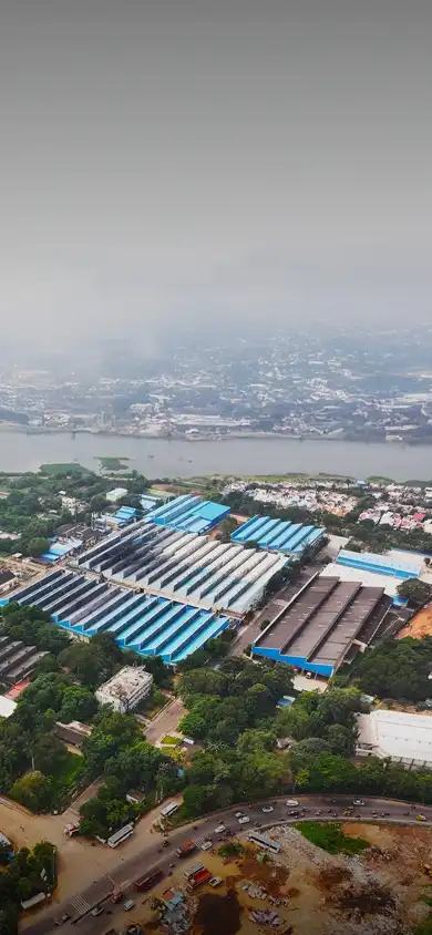 Aerial view of an industrial area/plant, showcasing factory buildings, machinery, and infrastructure from above.